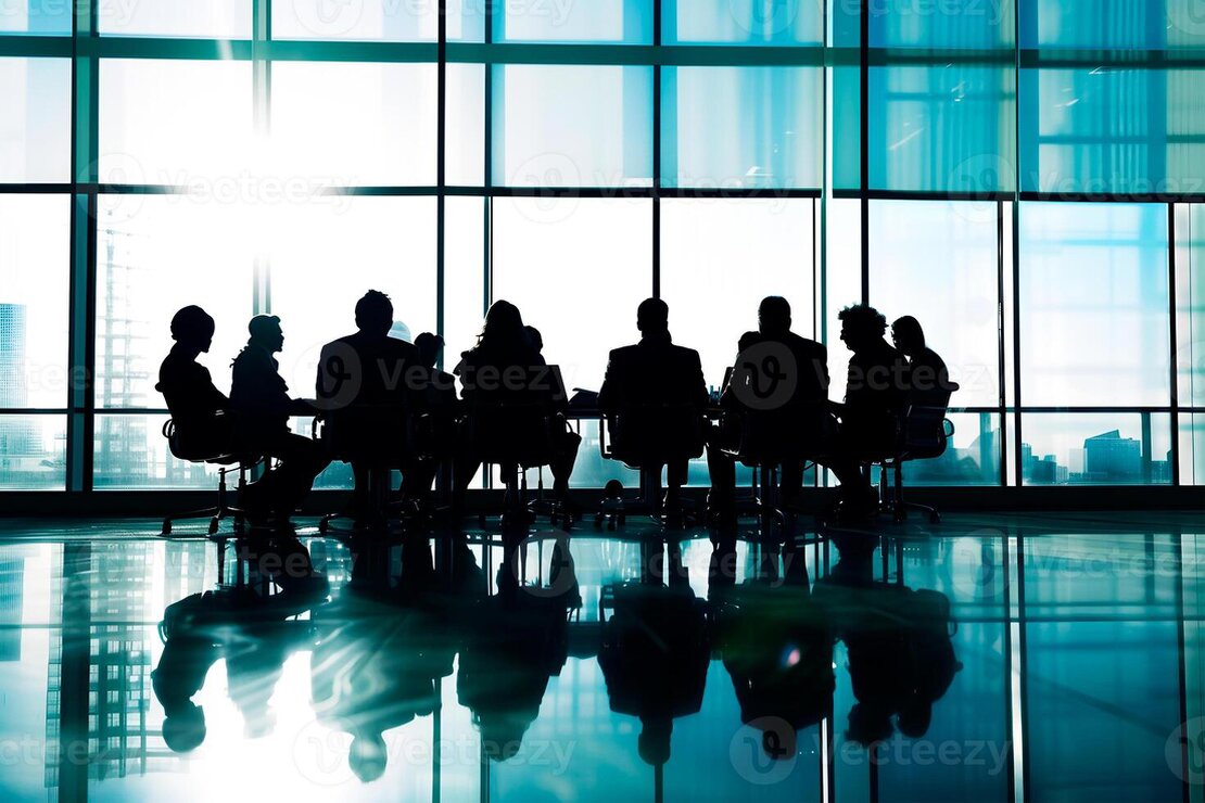 Gruppo di lavoratori che partecipa a un incontro formativo sulla sicurezza.